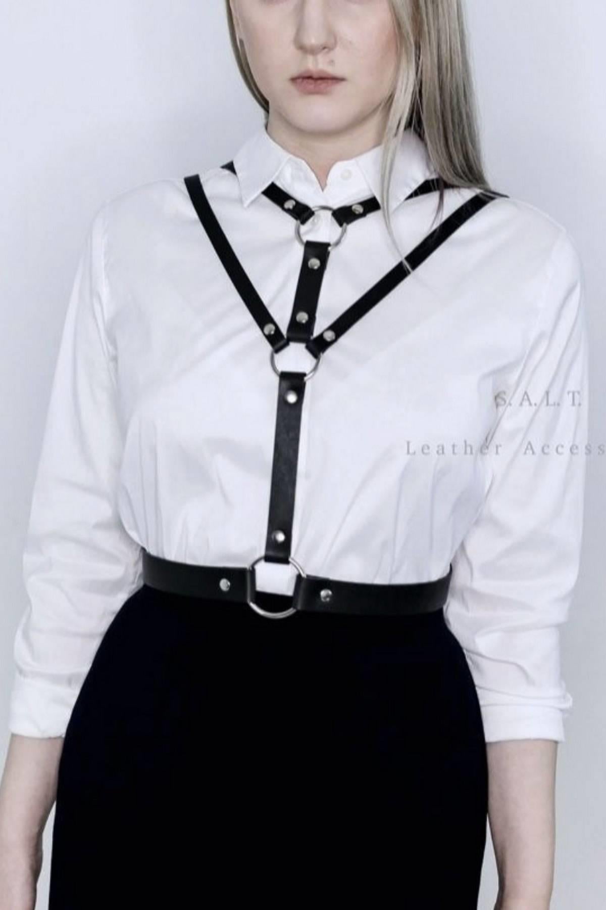 Different style leather accessories on top of dress 800707